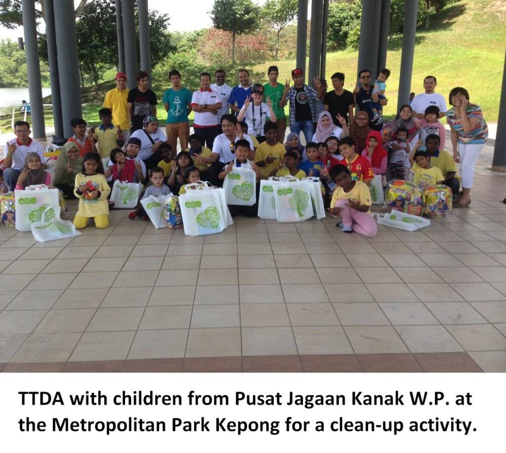 TTDA with children from Pusat Jagaan Kanak W.P. at the Metropolitan Park Kepong for a clean-up activity